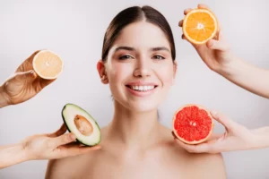 healthy-beautiful-radiant-skin-woman-without-makeup-portrait-girl-smiling-against-wall-fruits_197531-13860