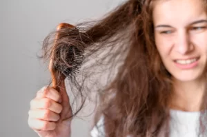 woman-struggling-brush-hair_23-2148547377